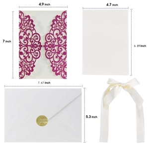 Flat lay showing rose red laser cut invitation cover with white inserts and envelopes