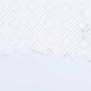 Elegant white hollow out lace polo shirt with long sleeves and wavy scalloped hemline