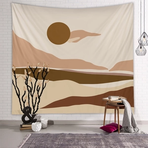 Detail of Bohemian tapestry with sun and mountain motifs in a cozy home setting