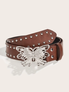 Detail of brown leather belt with silver butterfly buckle and metallic studs decoration