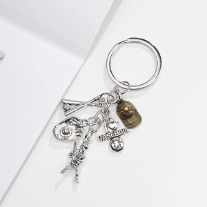 Macro shot of silver and bronze baseball charms including bat glove and I love Baseball tag