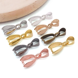 Detailed close-up of colorful metal pendant bails in gold, silver, and copper finishes