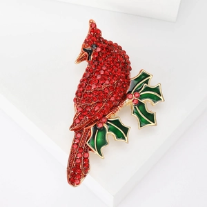 Elegant cardinal bird on holly branch brooch with red crystals and green enamel details
