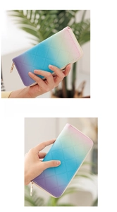 Detail of pink-blue gradient long wallet with diamond lattice texture and gold zipper