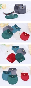Detail of velvet jewelry pouches with metal snap button in various elegant colors