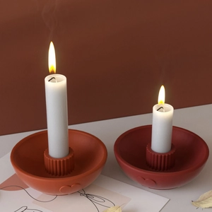 Ceramic striped heart candle holder tray set with white pillar candles in warm home setting