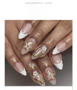 Close-up of short almond nails with 3D white resin flowers and pearl embellishments
