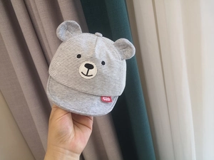 Detail of baby bear baseball cap with gray striped fabric and 3D ears embroidery