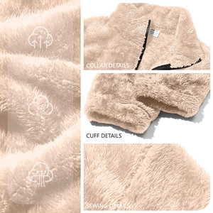 Detail of beige fleece jacket showing zipper collar, ribbed cuffs and flat seam texture