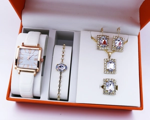 Square rose gold quartz watch with Roman numerals and matching jewelry set in a gift box
