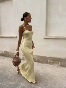 Chic pale yellow ribbed knit maxi dress with slim spaghetti straps in a sleek A-line fit