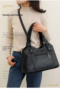 Détails du grand sac cabas en cuir lavé noir avec poches zippées et bandoulière réglable