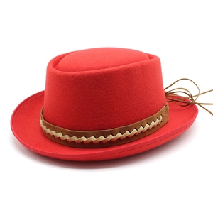 Red wool felt wide brim boater hat with a brown leather decorative band and rear ties