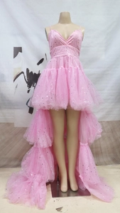 Detail view of pink tulle dress featuring silver star sequins and tiered mesh layers