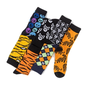 Detail of assorted crew socks with skull, tiger, and leopard prints in vibrant colors