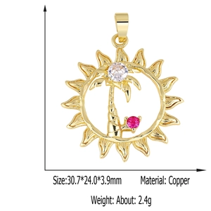 Detail view of gold sun and palm tree pendant with clear and pink zircon stones