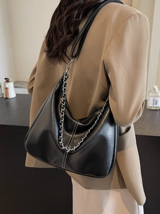 Retro black leather hobo underarm bag with silver chain and white contrast stitching