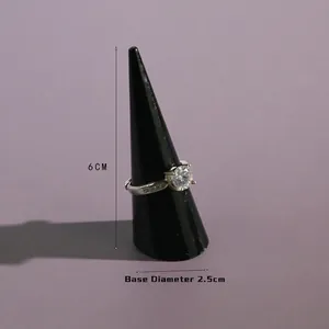 6cm black cone jewelry display stand holding a silver ring with clear round zircon stone