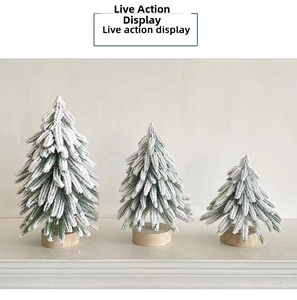 Miniature flocked Christmas trees set with snow effect and natural round wooden base