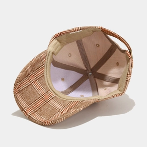Plaid pattern baseball cap showing interior lining and adjustable back strap detail