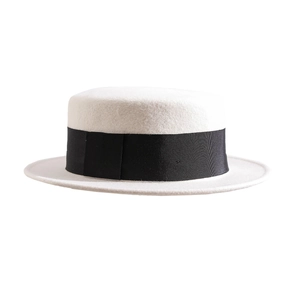 Elegant white wool felt boater hat with black grosgrain ribbon trim in a side profile view