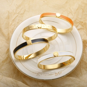 Set of four gold-plated stainless steel bangles with Roman numerals and colored enamel