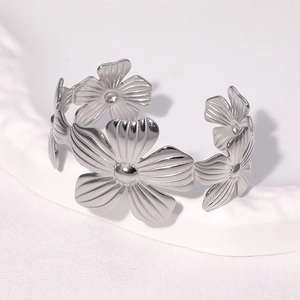 Silver stainless steel open bangle featuring vintage multi-petal floral pattern design