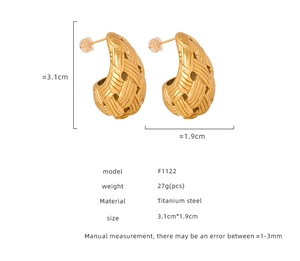 Macro view of woven teardrop gold earrings with size specifications and weight details
