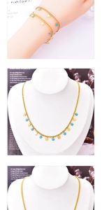 Detailed close-up of golden necklace and bracelet set with blue enamel star and moon charms