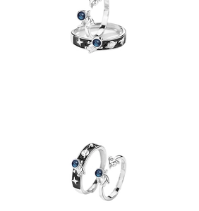 Detailed view of astronaut couple rings with S925 hallmark and blue enamel rocket design