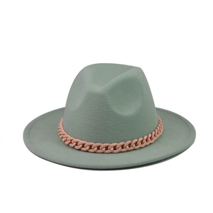Detail of sage green wool fedora hat with a pink orange chain strap decoration