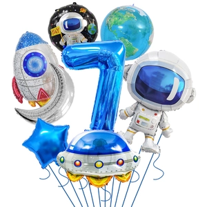 Detail of space theme foil balloon set with astronaut rocket and number seven
