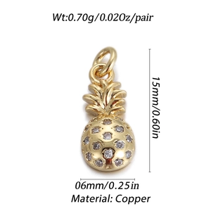 Macro shot of 14k gold-plated pineapple charm with crystals and size specifications