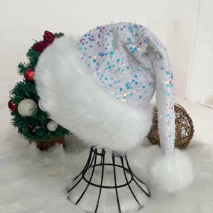 Detail of long velvet Christmas hat with iridescent sequins and fluffy faux fur trim
