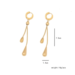 Detailed view of long gold tassel earrings with teardrop pendants and dimensions 7.5cm