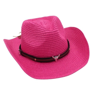 Detail of rose pink straw cowboy hat with leather band and metal bull head pendant