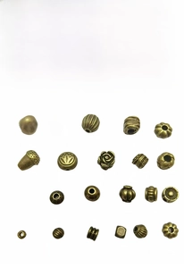 Macro detail of various antique bronze alloy spacer beads for DIY jewelry making