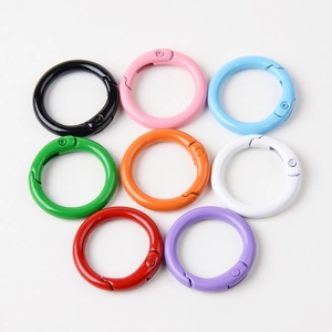 Macro view of 23mm colorful metal spring gate rings in a variety of vibrant paint finishes