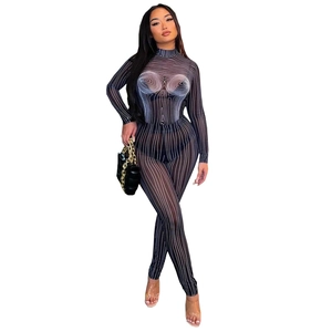 Detail of slim-fit mesh two-piece set featuring black and white striped body contour print