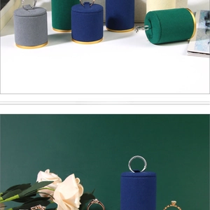 Detail of solid wood ring display stands with premium velvet finish and gold decorative rings