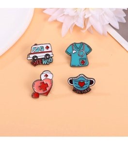 Set of four medical enamel pins featuring ambulance and nurse hat on orange backdrop