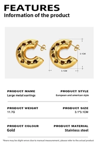 Macro detail of gold 18K plated stainless steel C-shaped earrings with hollow heart design