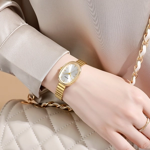 Elegant gold oval quartz watch with minimalist metal chain strap for women
