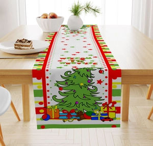 Detail of Christmas table runner with Whoville tree and gift boxes on wooden surface