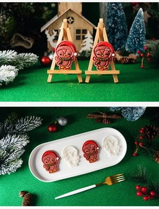 Detailed view of 3D Christmas penguin cookie molds with festive penguin-shaped results