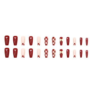 Red and pink press-on nails set with heart patterns, checkers and cream bow accents