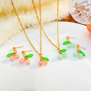Sweet red and green cherry necklace and earring jewelry set with gold twist chains