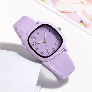Detail view of square purple watch with silicone strap and Arabic numerals on dial