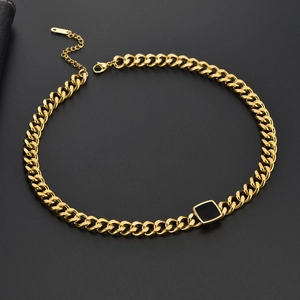 Detailed macro view of a gold Cuban chain necklace with a black square pendant and lobster clasp