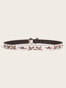 Close-up of white Y2K belt featuring brown butterfly embossed patterns and silver buckle